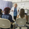Students and instructor interacting in a community health clinic